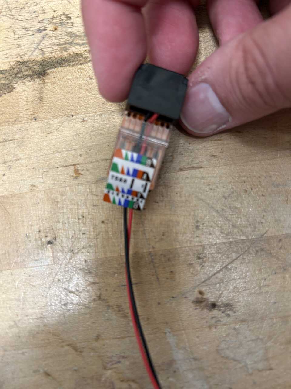 Dangling RJ45 jack for flow-through detail